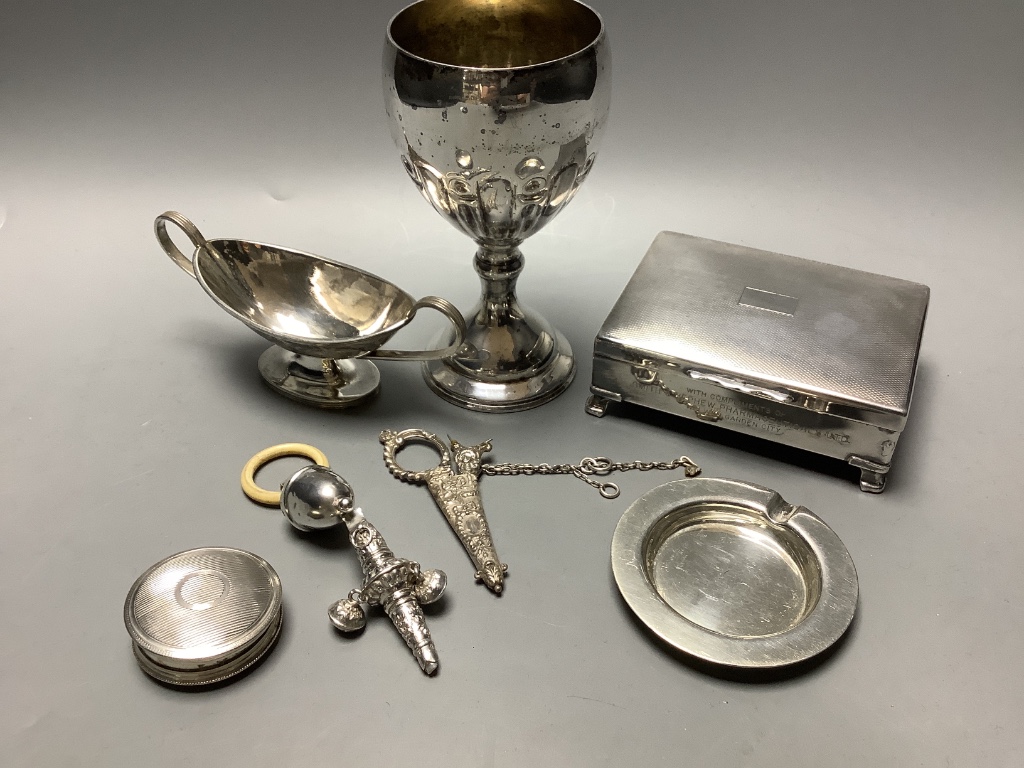 Two silver baby's rattles (a.f.), a Dutch white metal pill box, a silver two handled salt and four plated items.